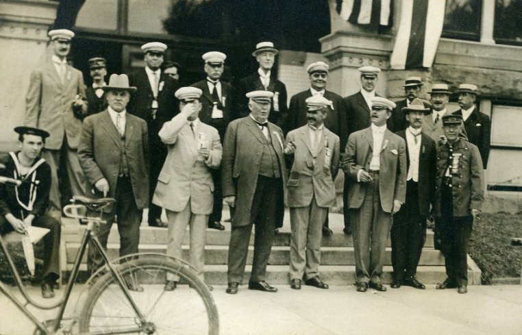 men on steps of city hall